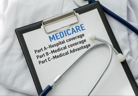 Medicare information on doctor’s clipboard.
